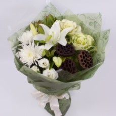 Bouquet in soft whites including Oriental lilies and roses.