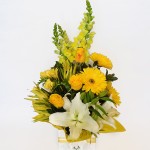 Yellow lilies, gerberas and roses.