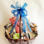 Hamper includes cheeses, savoury biscuits, tea, coffee, chocolates and jam.